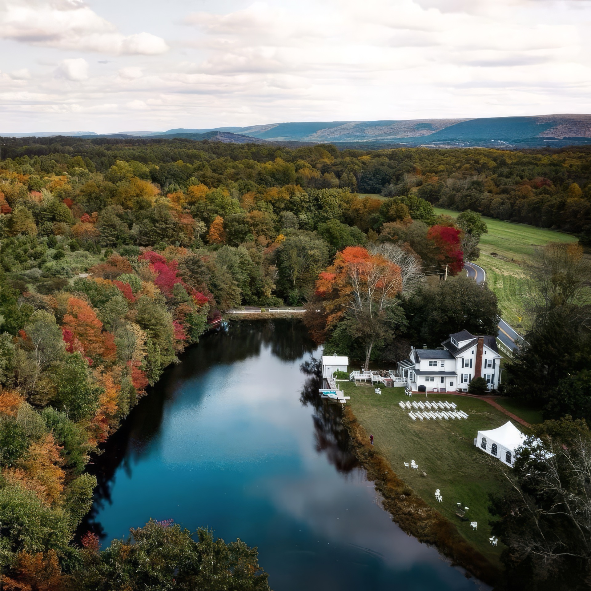 Stone Lake Retreat aerial view with private lake and fall foliage