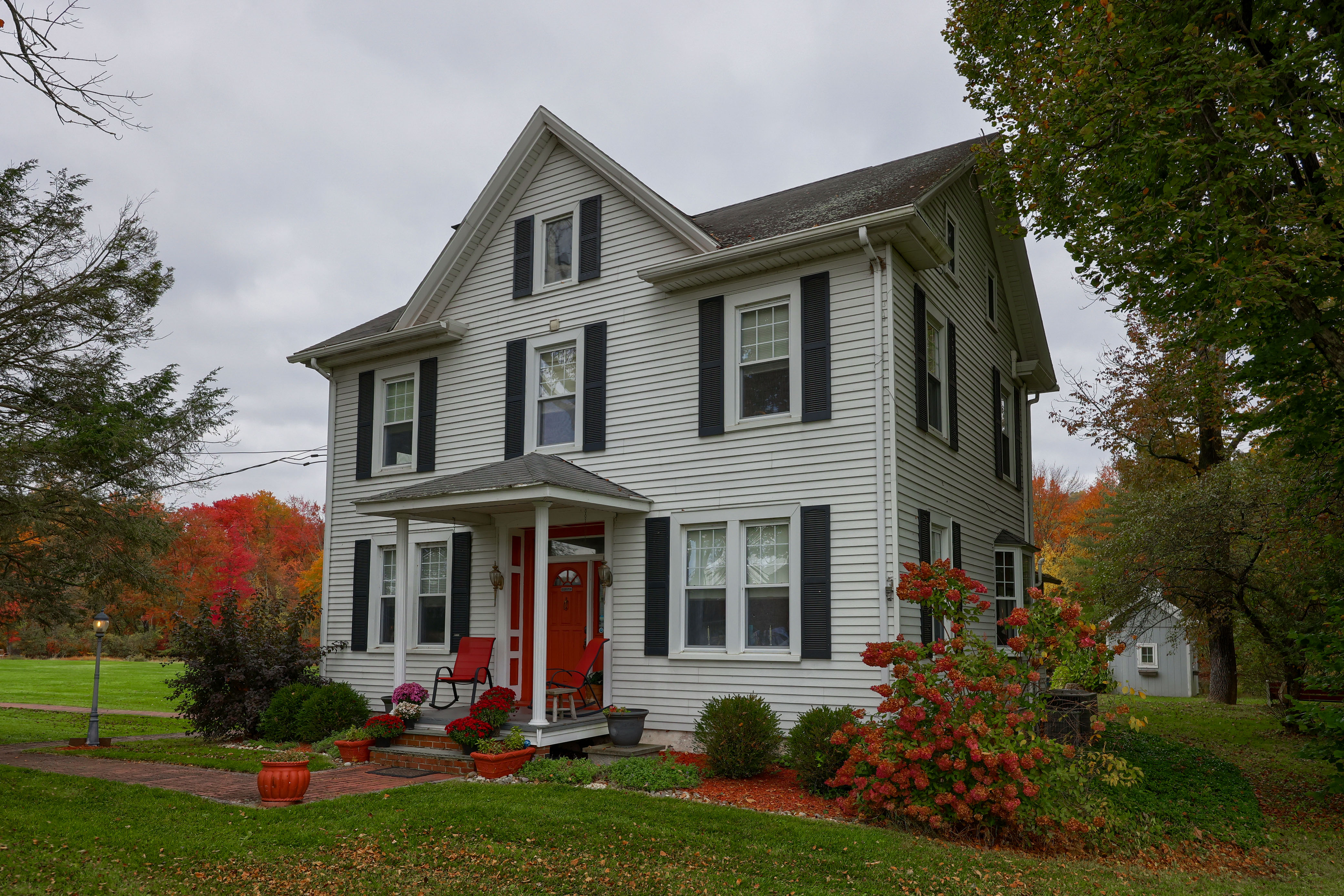 Stone Lake Retreat farmhouse with red front door